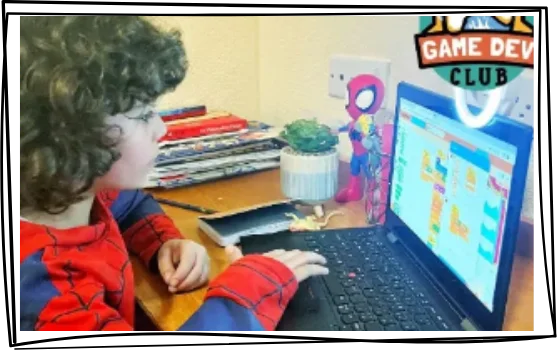Child enjoying their online coding club session, Game Dev Club
